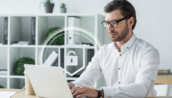 The security concept zero trust Man in front of laptop with security symbols