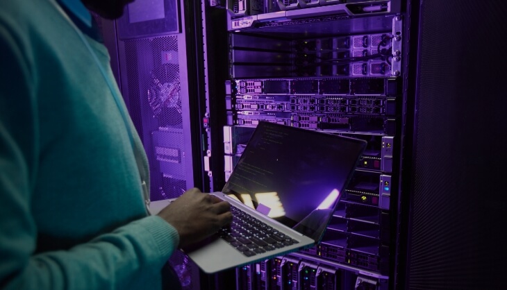 Man in dark server room Man in dark server room